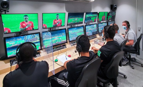 Picture of a group of people watching the VAR